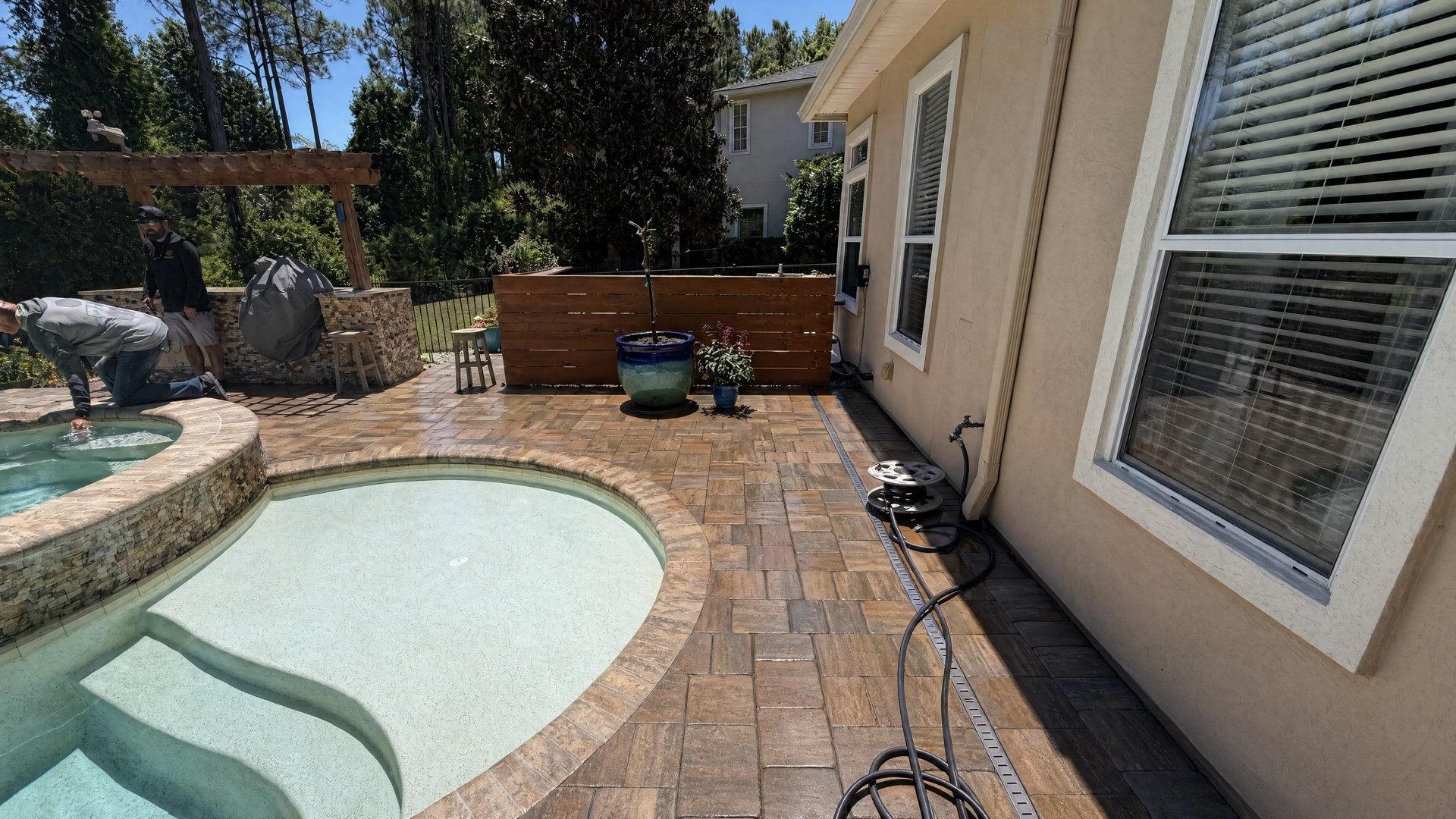 Side walkway after restoration with sealed pavers