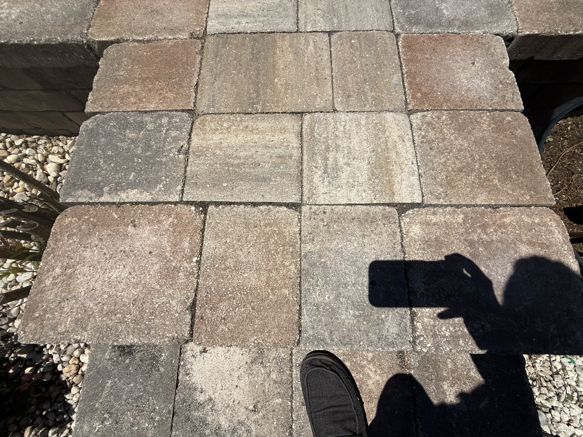 Joint sand displaced and sitting on top of paver surface